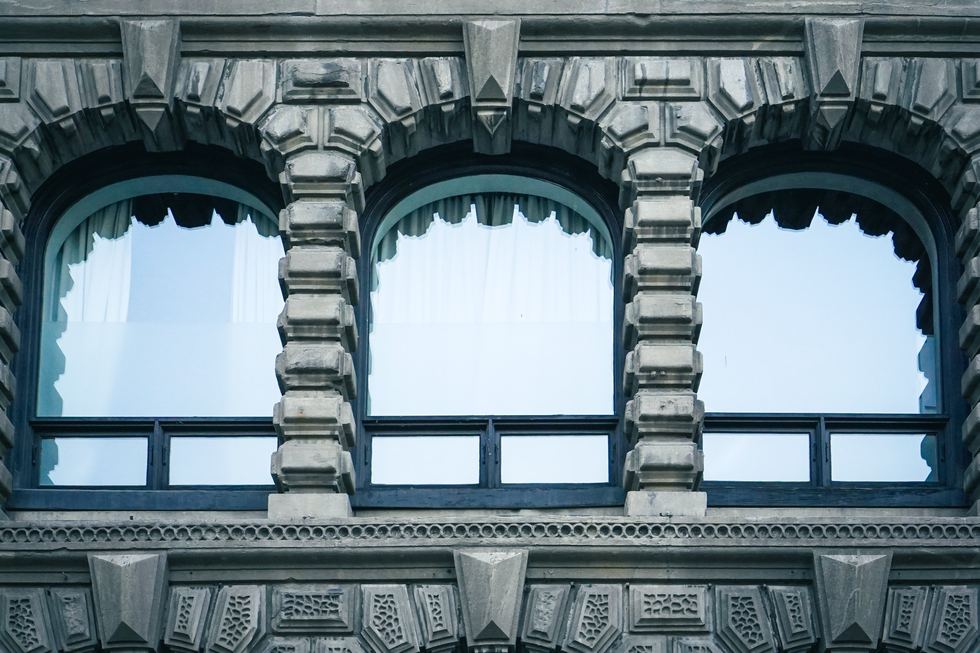 Close architectural view of broken arched windows